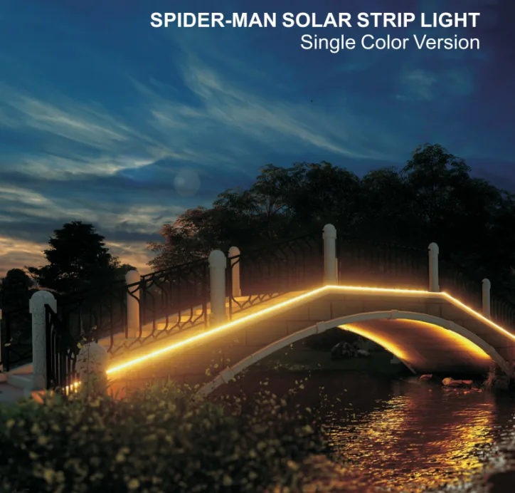 A solar-powered LED strip light illuminates the edge of a bridge at dusk over a reflective river.
