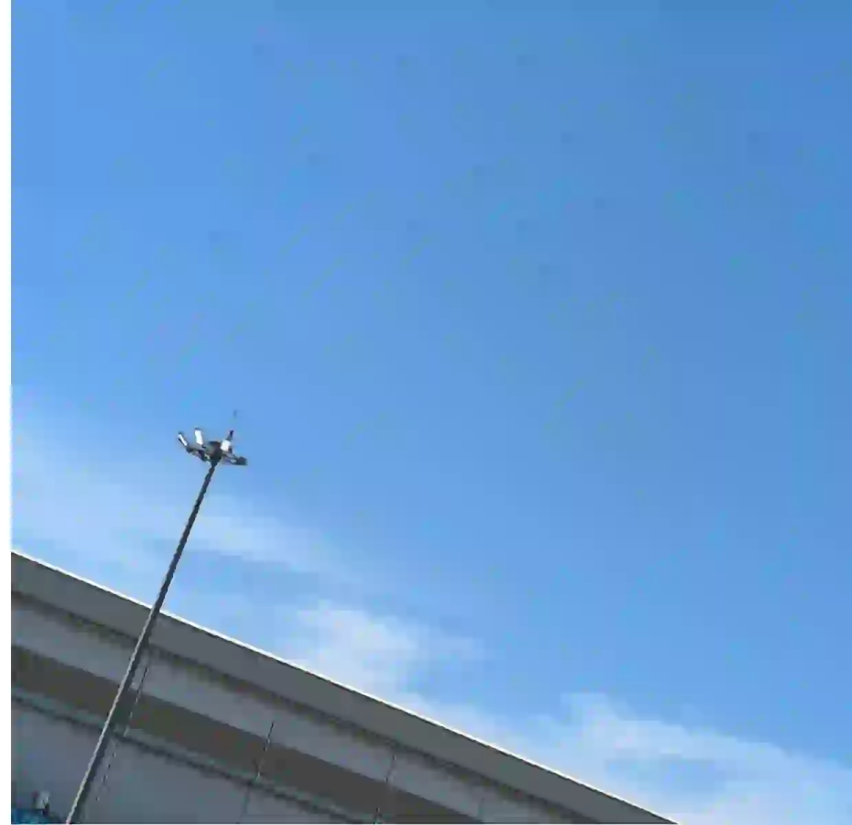 BSW lifting high-pole lights along an access road