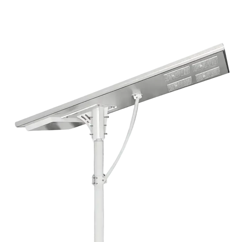 A white solar-powered street light with an integrated panel and LED array mounted on a pole.