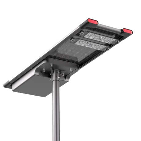 A black rectangular solar street light with integrated LED panels mounted on a pole with a support arm.