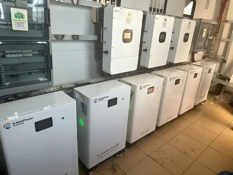 E-Able Power commercial energy storage — six 15.36kWh battery cabinets with inverter rack at a Togo partner site