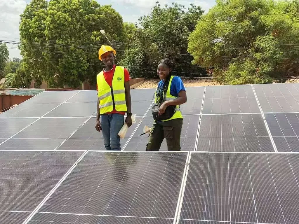 Partner technicians inspecting a rooftop solar installation